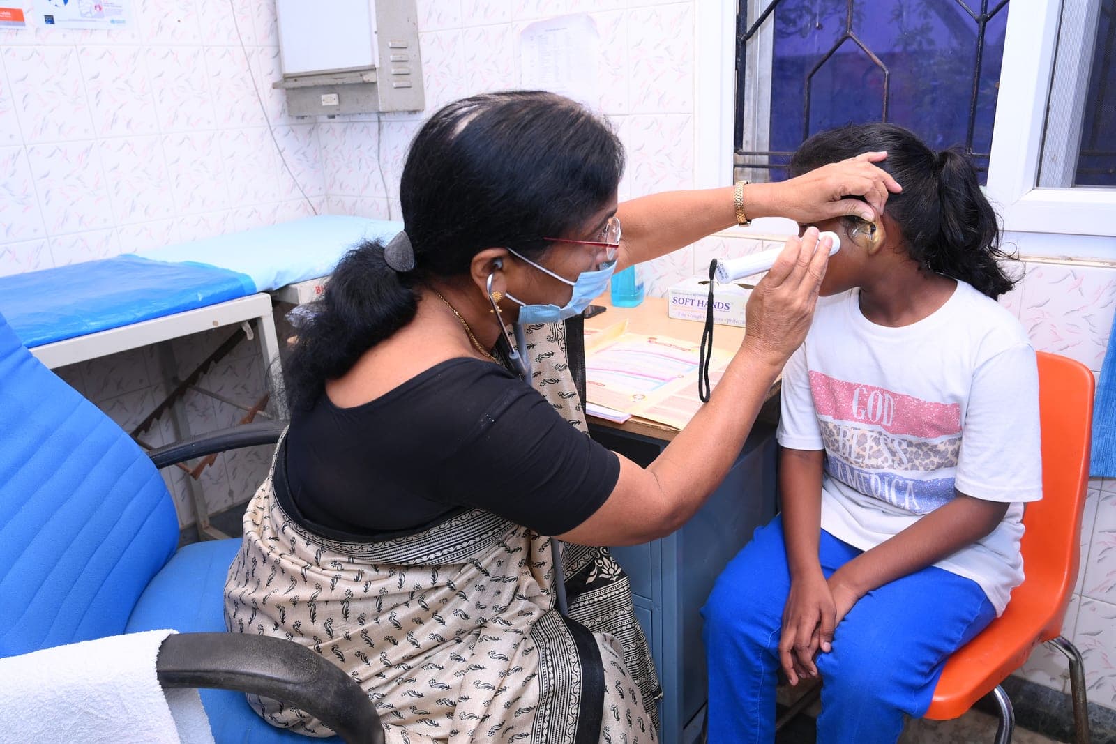 A doctor examining a child at a CMCT health screening